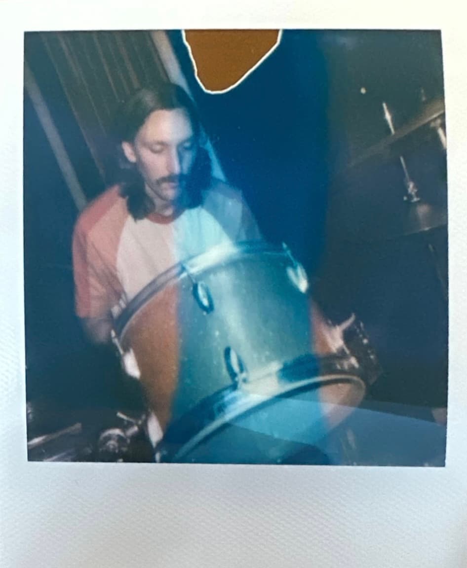 Instant photo of Kaden Smith with a floor tom.
